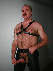 Jeremy Todd in a lether gear strokes his uncut mature cock