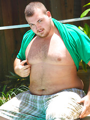 Chubby dude Hunter posing outdoors