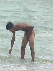 Two cute twinks at the beach sucking cock and fondling each other.