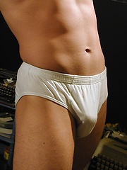 Hard bodied Danny Wynn strokes his cock.