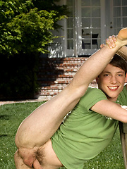 Cute twink posing on a lawn