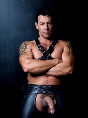 Muscle man in leather pants.