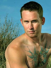Tattooed hunk Chris posing naked