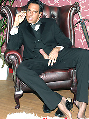 Marcello smoking a cigar in his tuxedo and then rubbing his hard dick