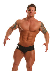 Mitchel Rock touch his muscled body and fat dick on a bed