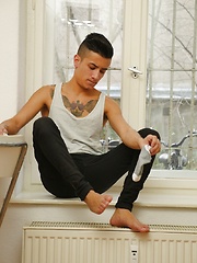 Tattooed twink Cory Prince stroking his big beautiful cock.