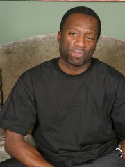 Black dude plays with his cock