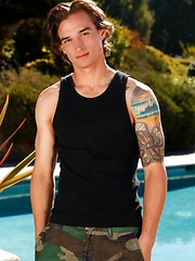 Tattooed lad Chad Pitt shows his cock